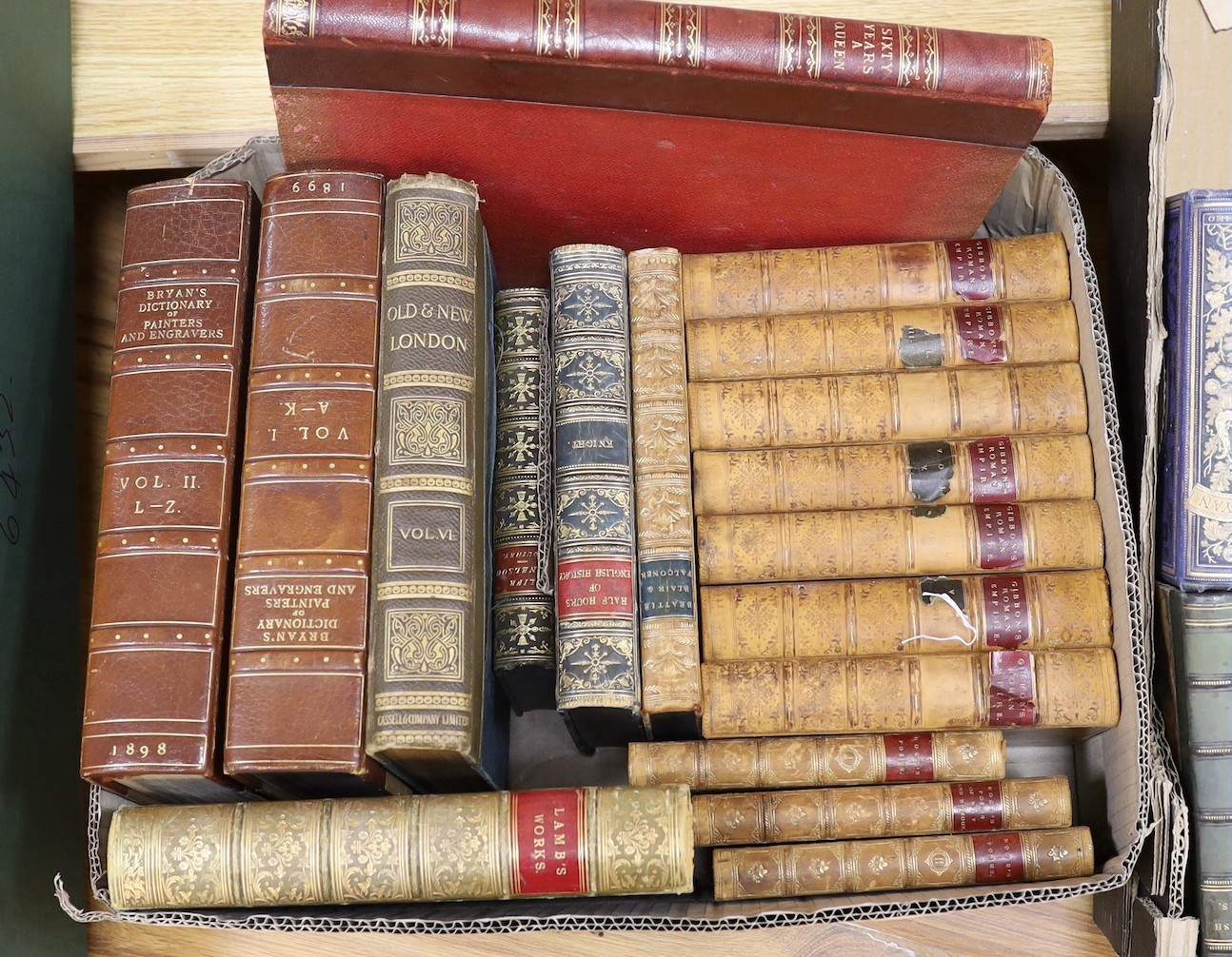 A selection of mixed book bindings varying in age, to include Lamb’s Works and Gibbon’s Roman Empire